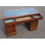 Victorian walnut pedestal desk with 9 drawers and a blue inset top, 72 x 120 x 59cm overall
