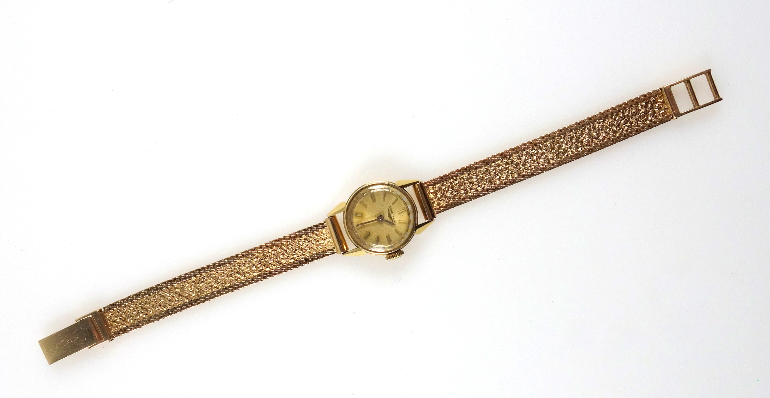 Longines 18ct gold Ladies wristwatch with a circular dial and baton markers, enclosing a side wind