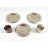 3 small Egyptian white metal dishes, one with base stamped, and 2 napkin rings, stamped. 175grs.