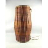 An African hide covered drum, 53cm, (split to one hide); African sandstone statue 32cm; two
