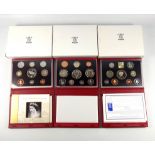 Elizabeth II de luxe Proof sets of coins, 1999-2004, including the 2000 Millennium Executive set, in