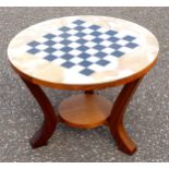 Italian coffee table with a circular onyx inlaid checkerboard top, with under tier, on 4 teak