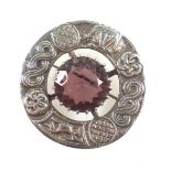 Victorian Scottish silver circular brooch set amethyst, within a Celtic border, by R A Robert,