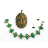 Chinese oval jade pendant with gilt metal mounts, 5.3 x 2.8cm, similar bracelet, and a pair of ear