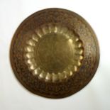Large Middle Eastern brass table top, all round floral engraving with black, orange and yellow