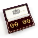 Pair of 18ct gold pierced oval "dumb-bell" cufflinks, 7.2grs, in a Harrods case. (3)