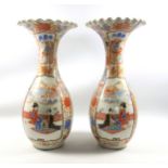 Pair of large Japanese Imari baluster vases, with peacocks and foliate decoration, reserves of