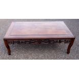 Chinese caved hardwood low table with a pierced Greek key frieze, on shaped legs, 30 x 91.5 x 53.5cm