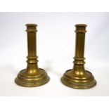 Pair of Victorian similar heavier brass candlesticks, unengraved and lacking nozzles, H.19.8cm. (2)