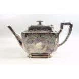 Victorian silver teapot with chased foliate decoration and swags surrounding two central vacant