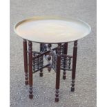 Eastern brass circular tray top table on a folding turned wood stand, Dia.60cm