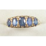 9ct. gold ring set five Ceylon sapphires, size P1/2, 3.6 grams