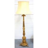 Italian carved giltwood lamp standard with a foliate baluster column on a circular base, 3 spreading