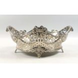 19th Century French pierced oval bowl decorated with ribbon swags, twin rams' heads handles and