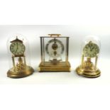 Kundo Kieninger & Obergfell electromagnetic mantle timepiece in a gilt and four glass case, H.