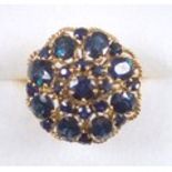 Vintage 1970's cocktail ring, size Q, set with sapphires within a rope twist border, unmarked