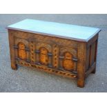 Victorian Charles II style carved oak chest with a floral inlaid arched 3 panelled front, and hinged