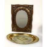 Indian shaped oval wall mirror in a rectangular brass elephant and bird decorated frame, 60 x 45.