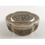 Eastern white metal pierced quatrefoil box with bird and floral decoration and a hinged cover, W.