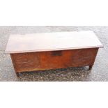 Spanish 18th century oak chest with a carved floral rounded front and moulded hinged rising top,