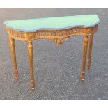 Louis XVI style carved giltwood serpentine fronted side table with a veined marble top and pierced