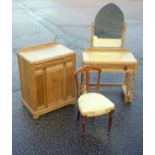 George V carved oak cabinet with a drawer and double panelled door, W.72cm; and a dressing table