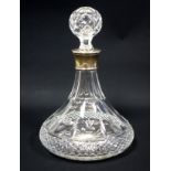 Cut glass ship's decanter with lattice and floral decoration, blown stopper, star cut base, and