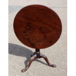 George III mahogany table with a one piece tilting circular "birdcage" top, on a "gun barrel"