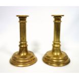 Pair of Victorian heavy brass candlesticks, each with a detachable nozzle and a cylindrical