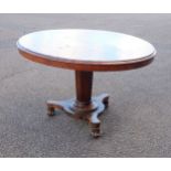 William IV rosewood table with a tilting oval top, on a tapering octagonal column, trefoil base,