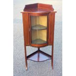Edwardian inlaid mahogany bow fronted corner cabinet with a galleried top, glazed panelled door