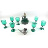 Continental green glass decanter, H.19.5cm; 7 claret glasses, and an Isle of Wight duck. (9)