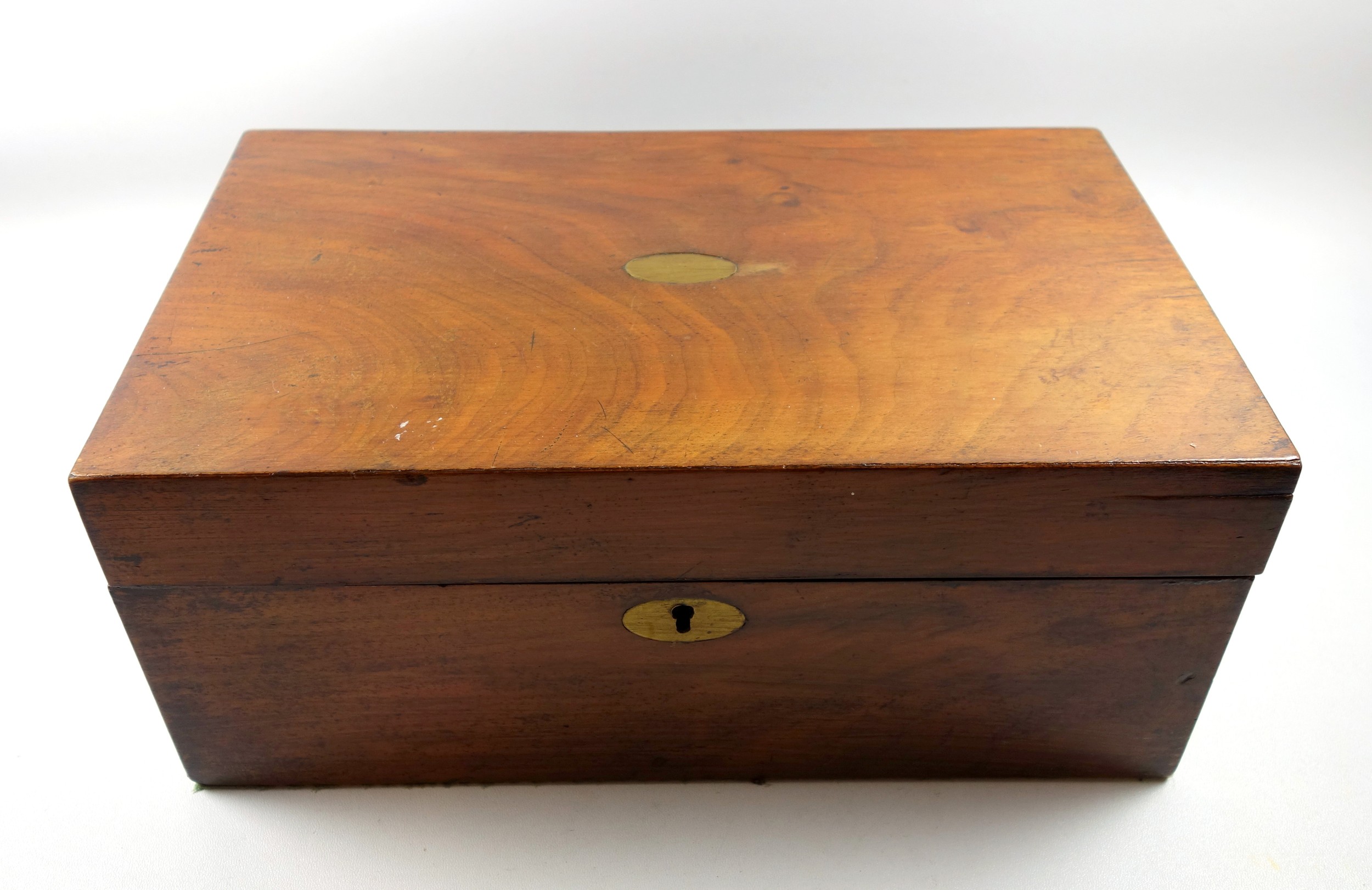 Victorian walnut writing slope with inlaid brass escutcheon and vacant cartouche to cover, purple