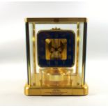 Jaeger-LeCoultre Atmos timepiece with a square blue enamel chapter ring with gilt Roman numerals,