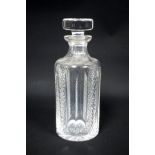 Waterford cylindrical glass decanter with cut lattice and fluted decoration, and stopper, on star