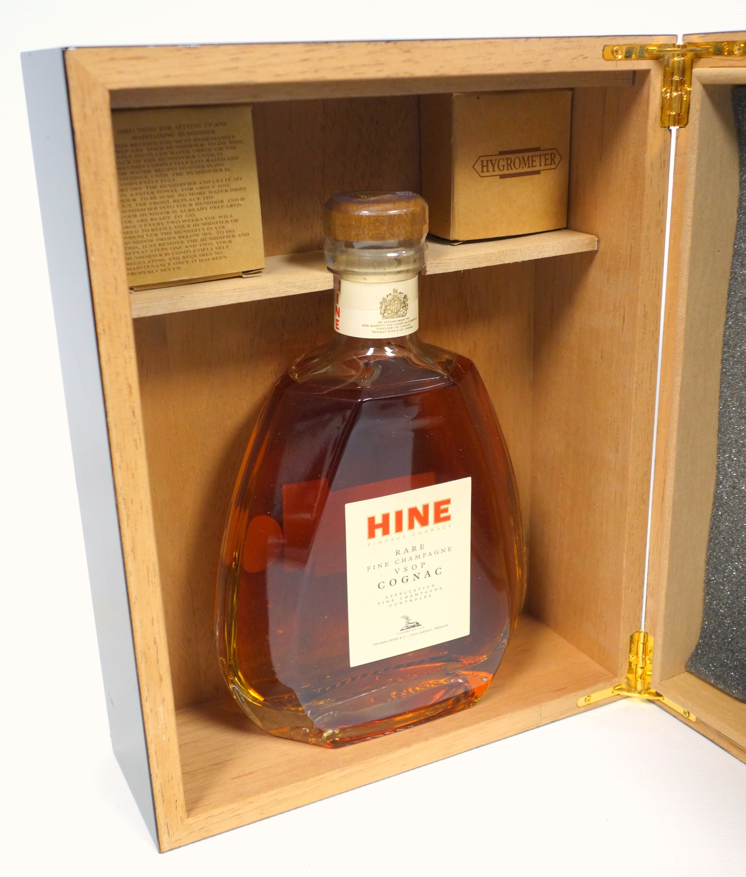 Bottle of Hine Rare Champagne VSOP Cognac, 70cl, 40% vol., with a hygrometer and humidifier in a