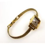 French ladies yellow metal wristwatch with a square dial and bark effect bezel, on a gilt metal