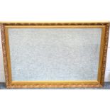 Rectangular bevelled glass mirror in a giltwood frame with beaded and scrolling foliate