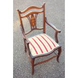 Edwardian child's inlaid mahogany open armchair with an inlaid floral splat black, scroll arms and