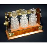 Victorian plated mounted walnut tantalus with 3 cut scent bottles and stoppers, on a plush lined