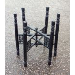 Eastern engraved brass circular tray top table, on a folding ebonised wood stand, D.58.3cm. (2)