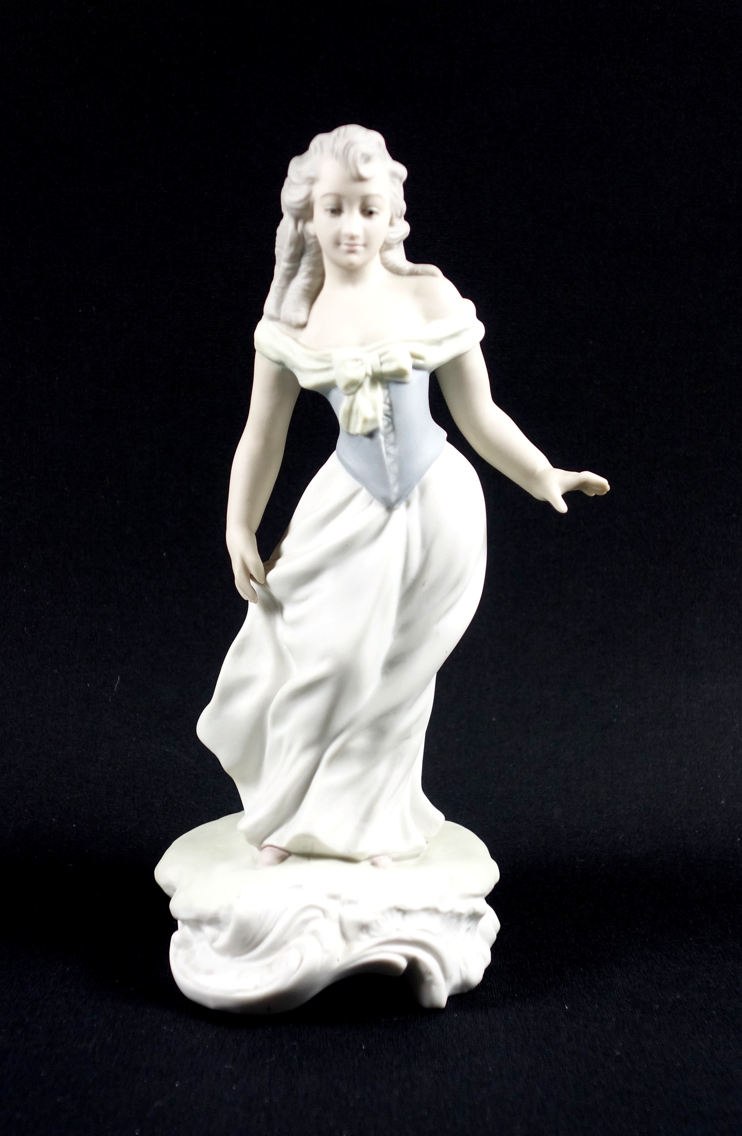 Lladro prototype bisque porcelain figure of a young woman, "The Prom", wearing a blue laced corset