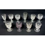 Victorian moulded glass goblet with faint amethyst colouration, 7 other goblets and 2 tall