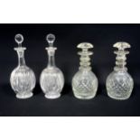 Pair of Edwardian ovoid decanters, each with cut fern and lattice decoration, septagonal neck and