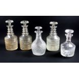 Pair of Edwardian cut glass cyclindrical decanters, each with a triple ringed neck and mushroom