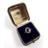 Gold ring set faceted oval sapphire and 13 diamonds, size F1/2, gross 2.6grs, cased