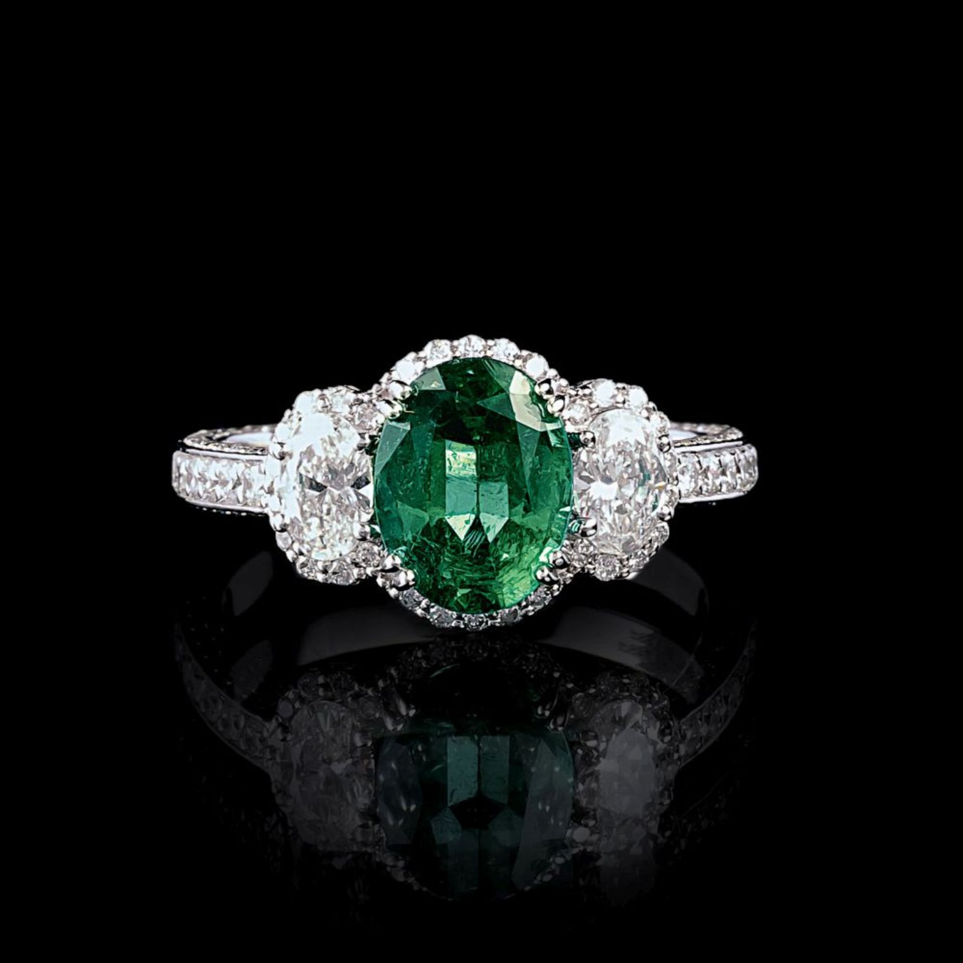 An Emerald Diamond Ring.