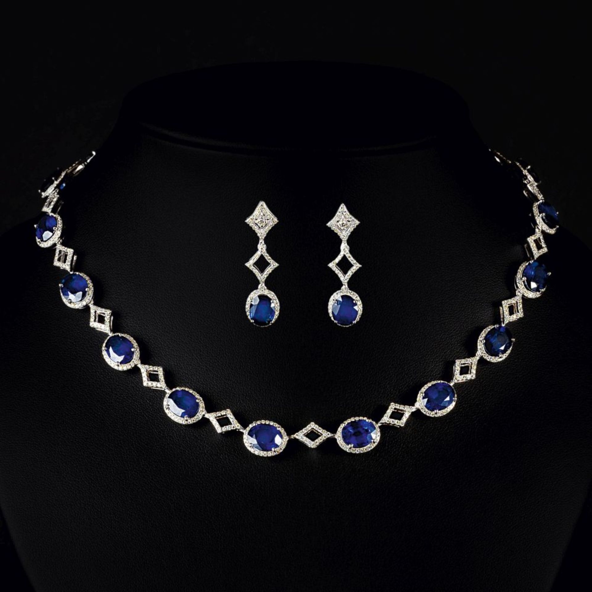 An exclusive Sapphire Diamond Necklace with matching Pair of Earrings.