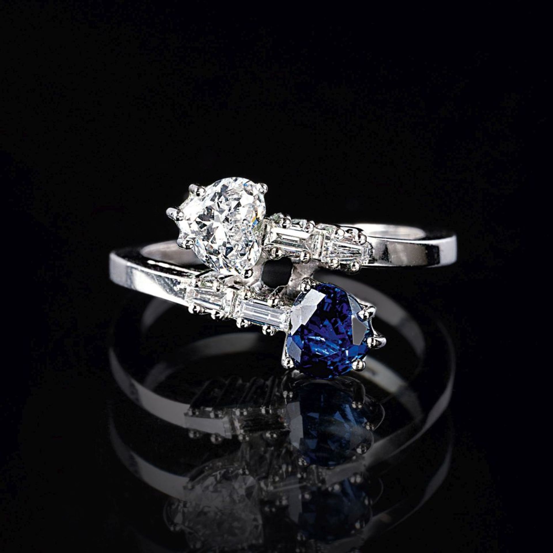 A Toi-et-Moi Ring with Hearts of Sapphire and Diamond.