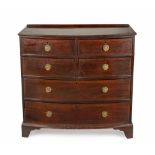 A GEORGE III MAHOGANY CHEST-OF-DRAWERS